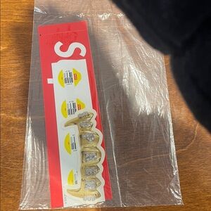 Supreme gold teeth sticker set